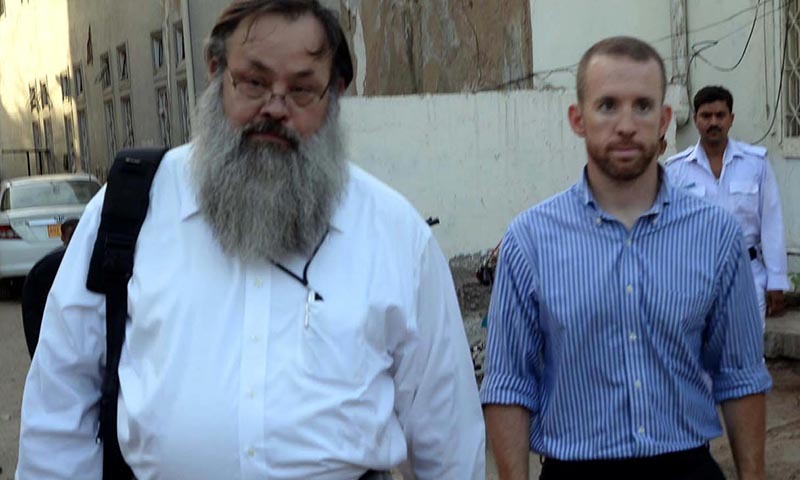 Federal Bureau of Investigation (FBI) agent arrested for trying to board a domestic civilian flight with bullets and a knife in his luggage identified as Joel Cox Eugene (in blue shirt),coming outside from Artillery Maidan Police Station after court granted him bail on payment of sureties of Rs 1,000,000 ($10,000), on Thursday May 8, 2014. — Photo by INP