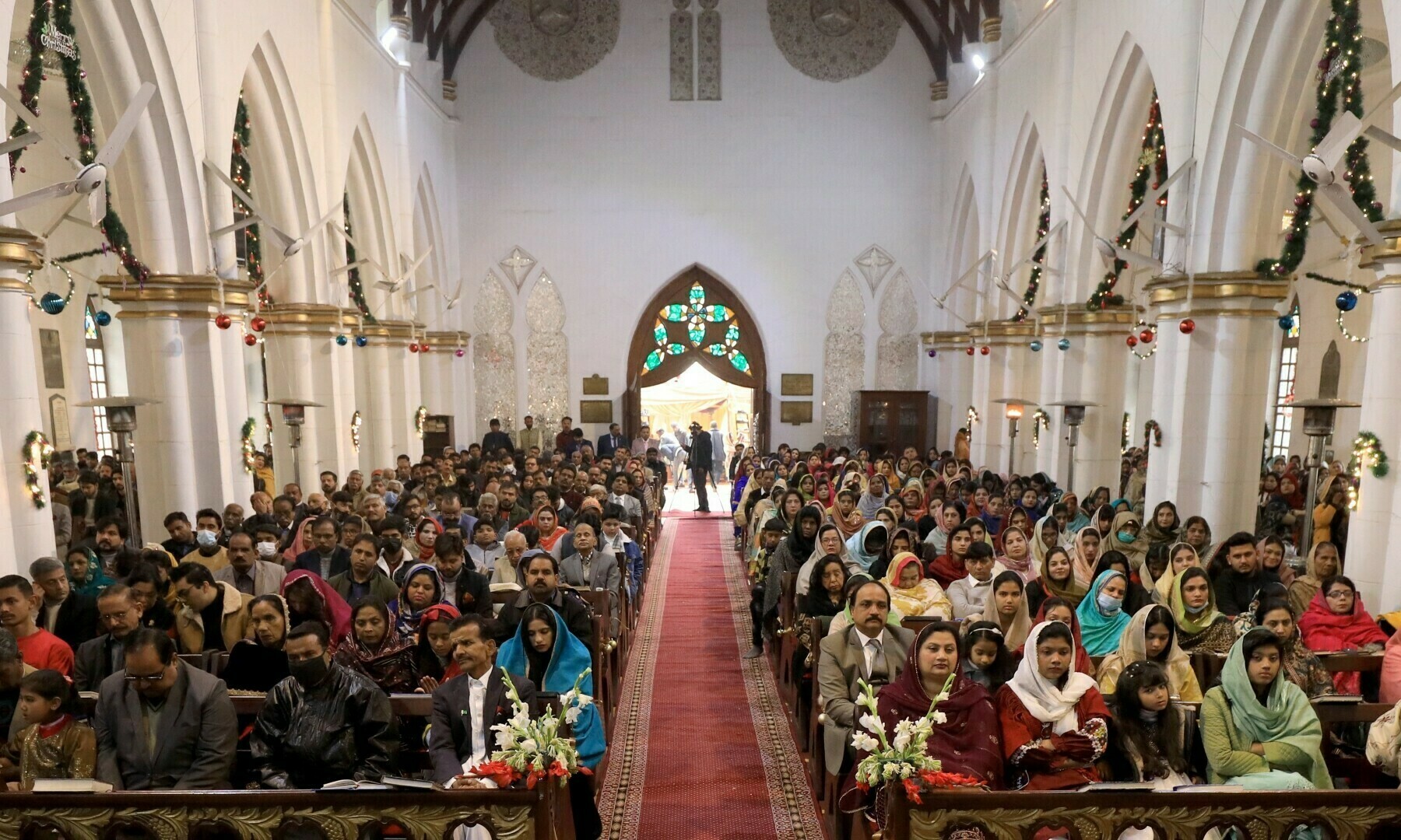 People attend a Christmas Day service at the St. John’s Cathedral in Peshawar, on December 25, 2022. — Reuters