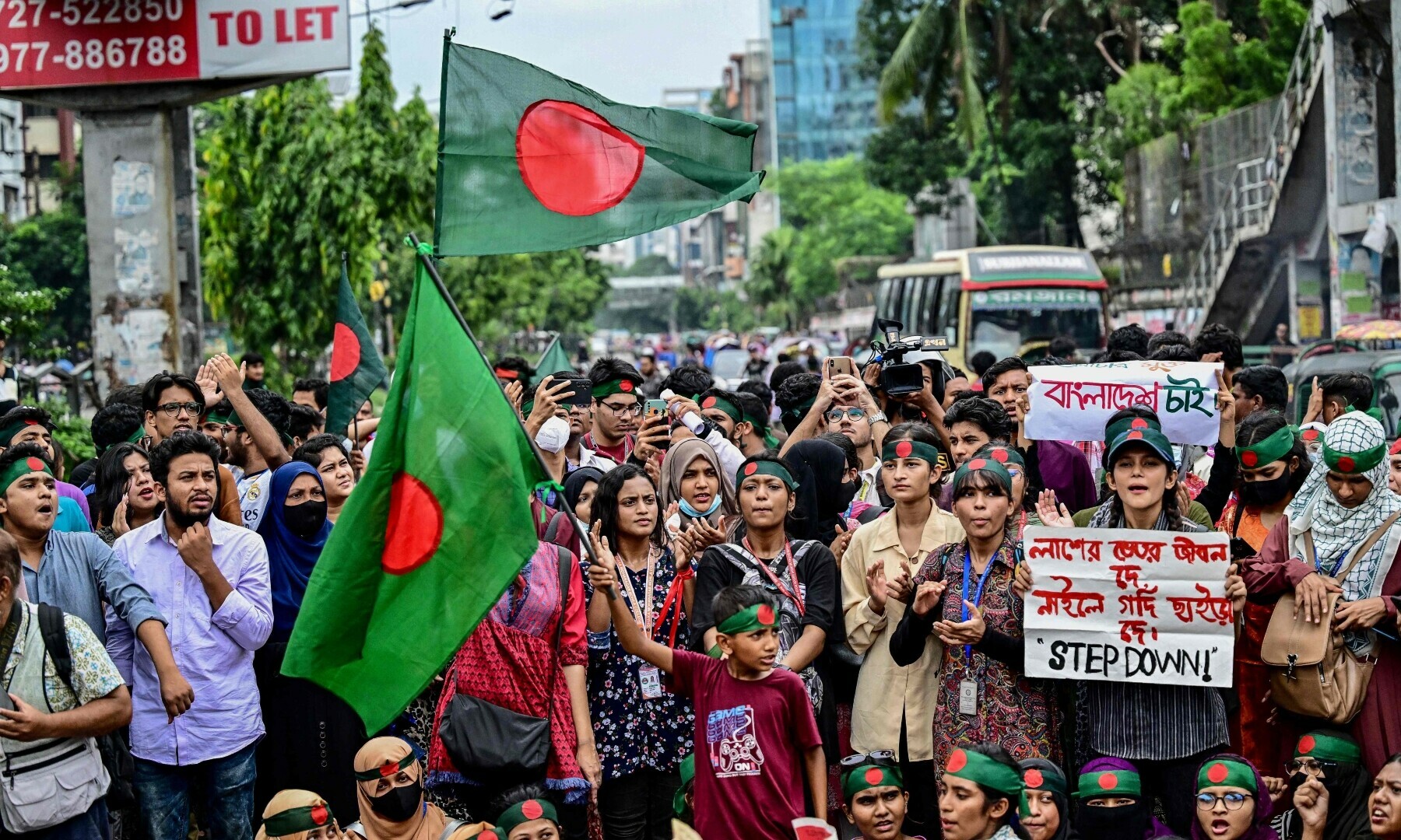 Students shout slogans during a protest march as they demand justice for victims arrested and killed in the recent nationwide violence over job quotas, in Dhaka on August 3, 2024. — AFP