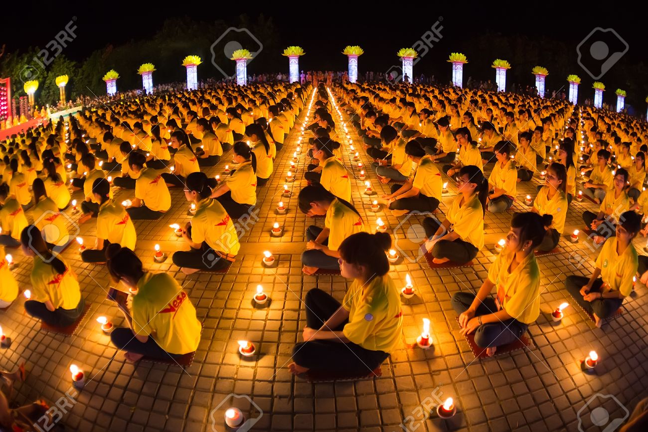 30372087-ninhbinh-vietnam--may-05--vesak-day-traditional-buddhist-monks-are-lighting-candles-for-religious-ce.jpg