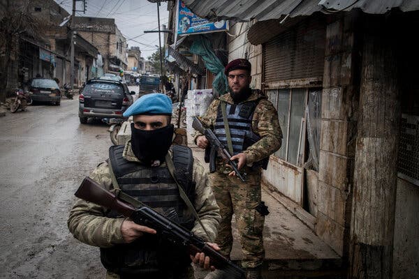 Turkish-backed Syrian security forces patrol the highly secured market area of downtown Afrin.