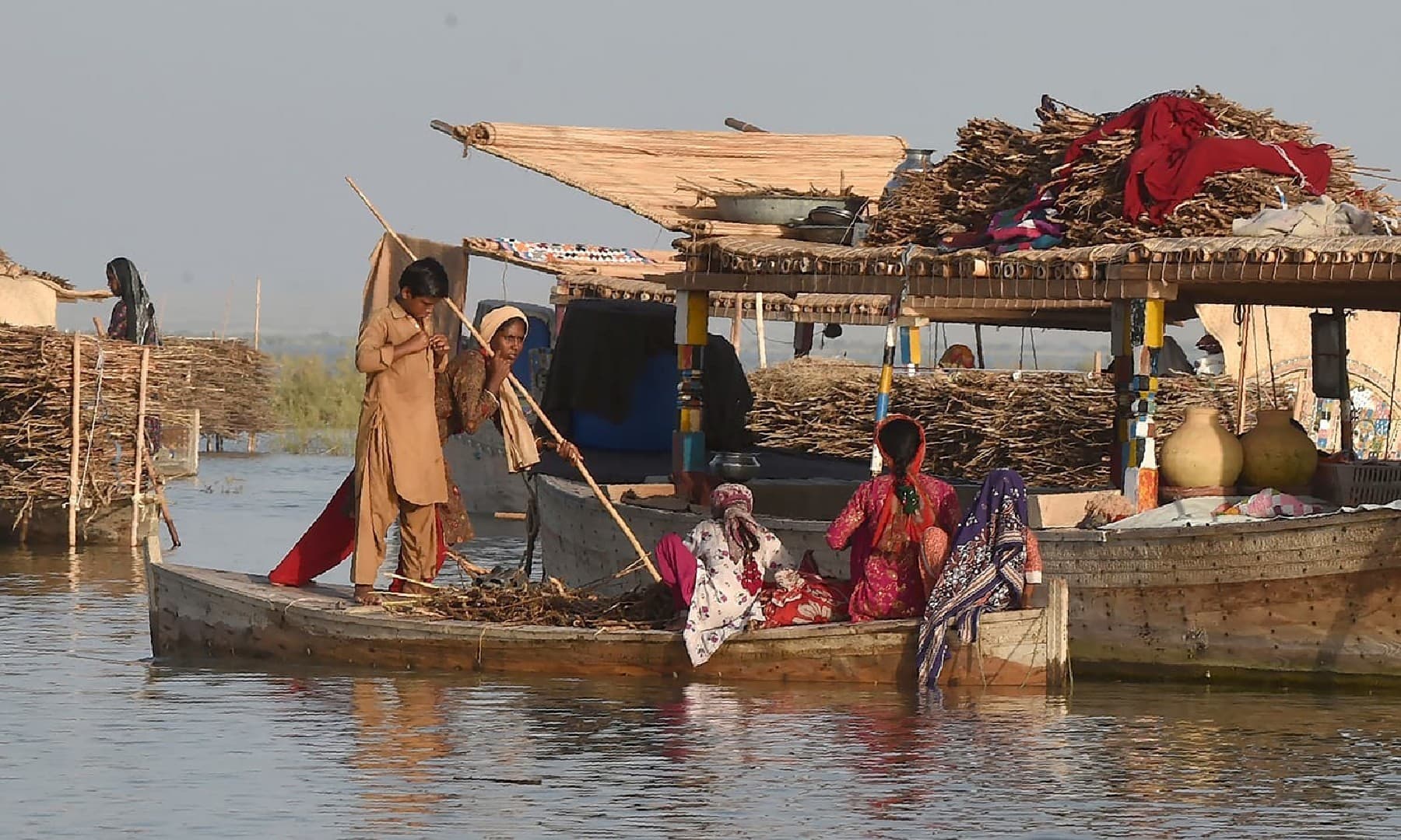 Some women were washing dishes, some boats were clothed and clothes were lying in the sun to dry - Mustafa Mirani