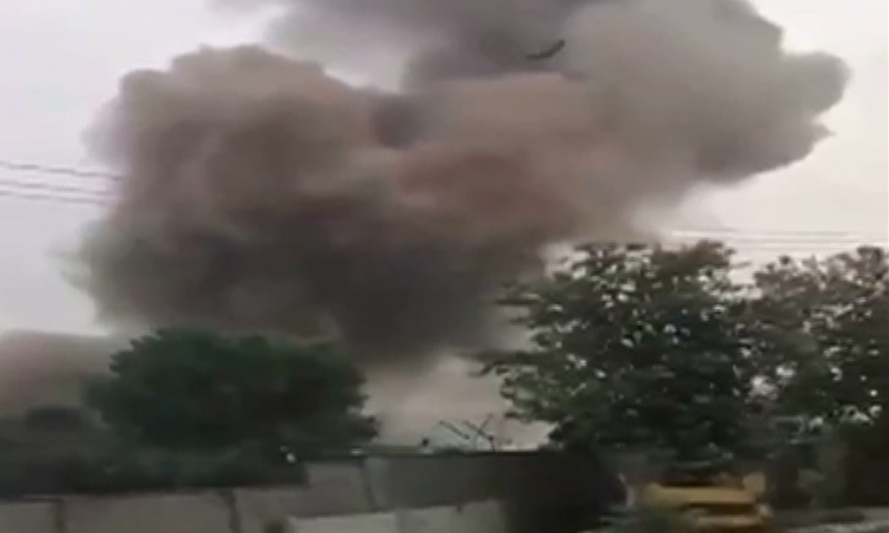 This screengrab shows smoke rising from the site of the explosion in Rawalpindi district's Wah Cantonment area on Thursday. — DawnNewsTV
