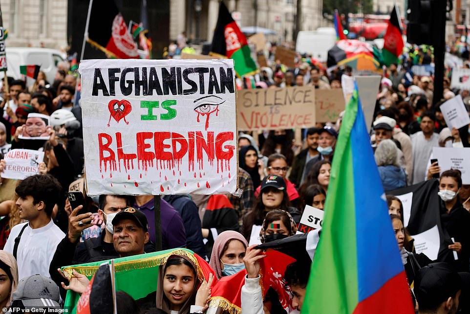 As they marched through Central London, another protesters held a poster which simply read: 'Afghanistan is bleeding''Afghanistan is bleeding'