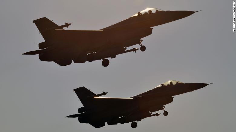 Two US-made F-16 fighters take off from the Chiayi Air Base in southern Taiwan during a demonstration on January 26, 2016.
