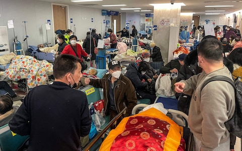 Patients on stretchers are seen at Tongren hospital in Shanghai on January 3, 2023