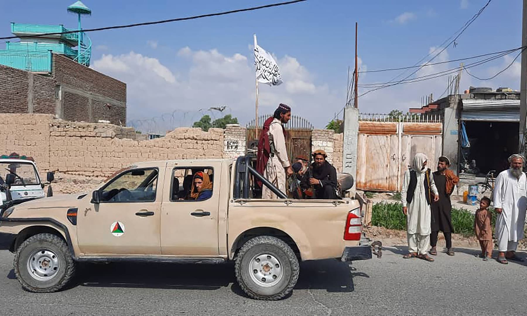 Taliban fighters drive an Afghan National Army vehicle through the streets of Laghman province, Afghanistan on August 15, 2021. — AFP