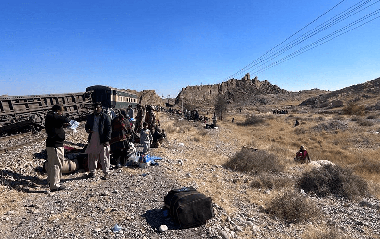 <p>Officials and passengers are seen at a blast-hit railway track in Paneer area of Bolan, Balochistan on Friday. — Photo by author</p>