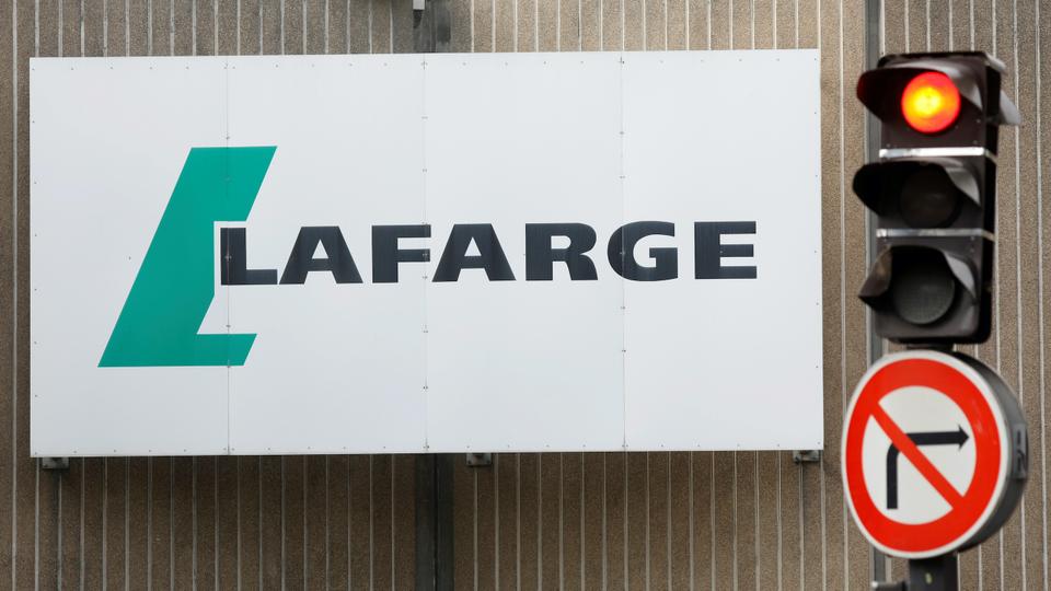 In this September 3, 2020 file photo, the logo of French concrete maker Lafarge is seen on the plant of Bercy on the banks of the river Seine in Paris, France.