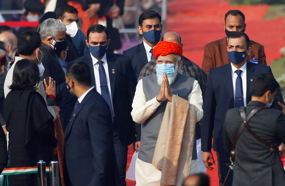 India's Prime Minister Narendra Modi greets the crowd as he arrives for the Republic Day parade in New Delhi. [Adnan Abidi/Reuters]