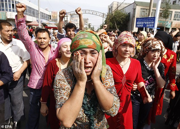 People belonging to the Chinese Uyghur Moslem minority protest in Urumqi, China, in 2009