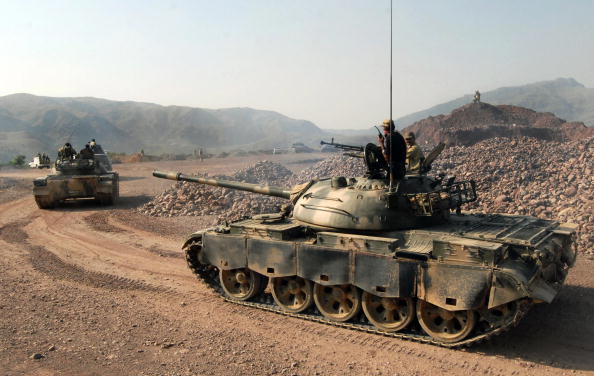 pakistani-army-soldiers-patrol-on-their-tanks-during-a-military-picture-id83061914