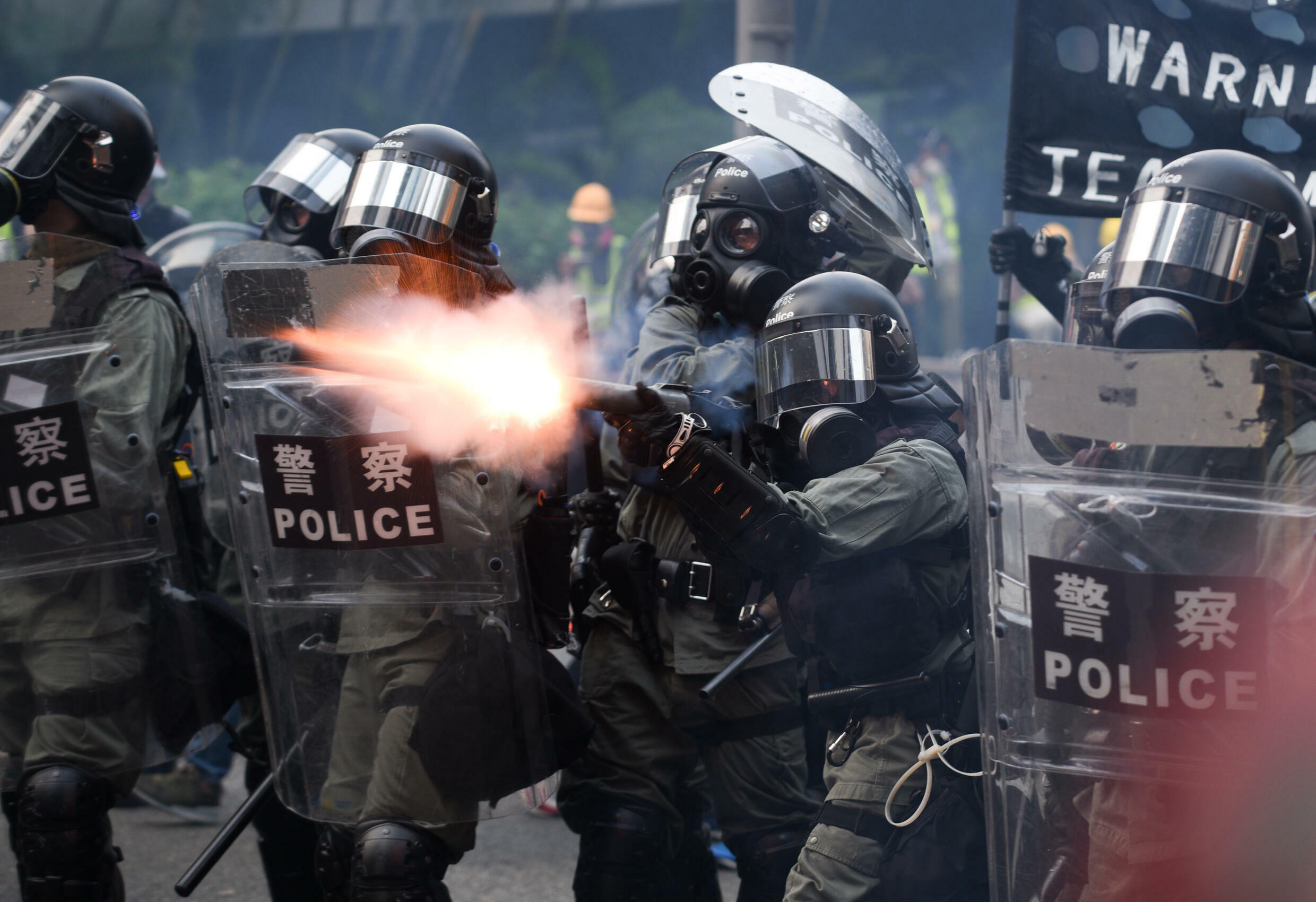 Riot police fire tear gas at protesters in Hong Kong in September 2019.