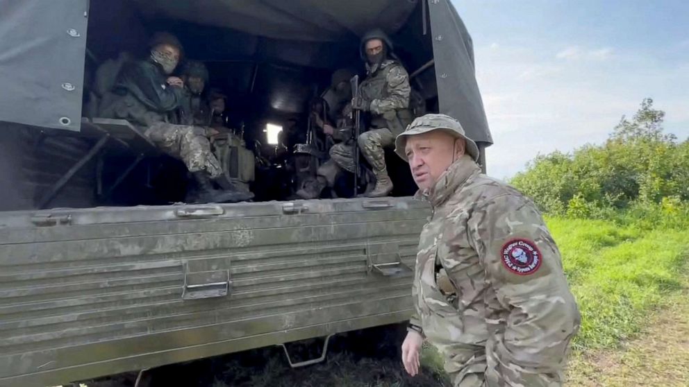 PHOTO:Founder of Wagner private mercenary group Yevgeny Prigozhin speaks with servicemen during withdrawal of his forces from Bakhmut and handing over their positions to regular Russian troops, June 1, 2023.