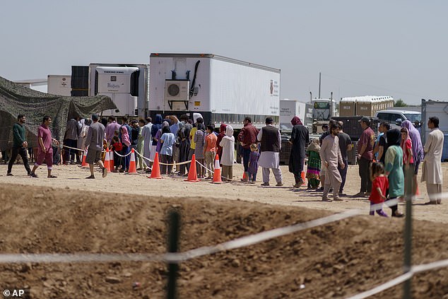 Refugees stood in line to find housing in the Dona Ana village complex