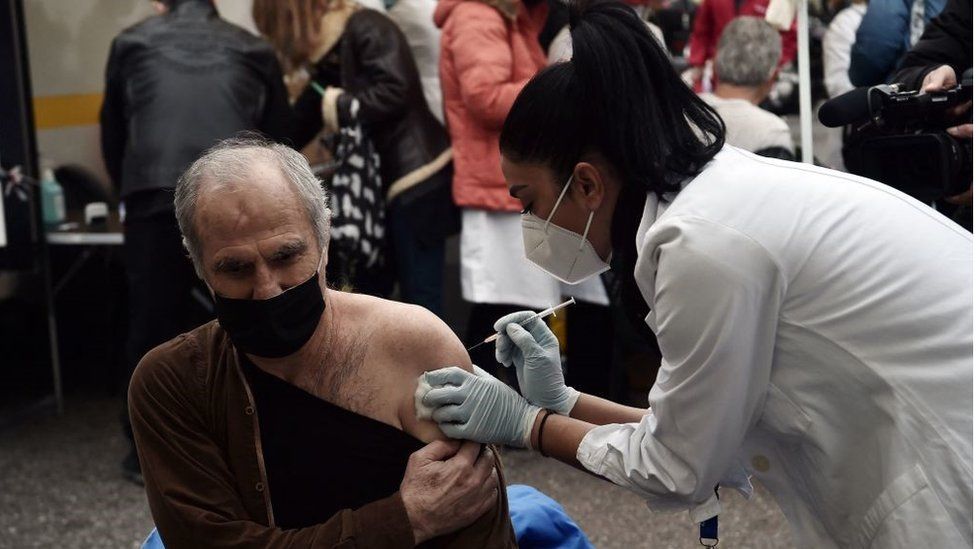 A patient receives a dose of vaccine against Covid-19 in Thessaloniki, Greece