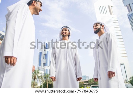 three-arabic-men-bonding-outdoors-450w-797840695.jpg