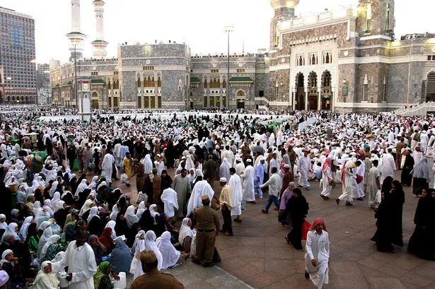 Muslim-pilgrims-wait-outside-Meccas-Grand-Mosque.jpg