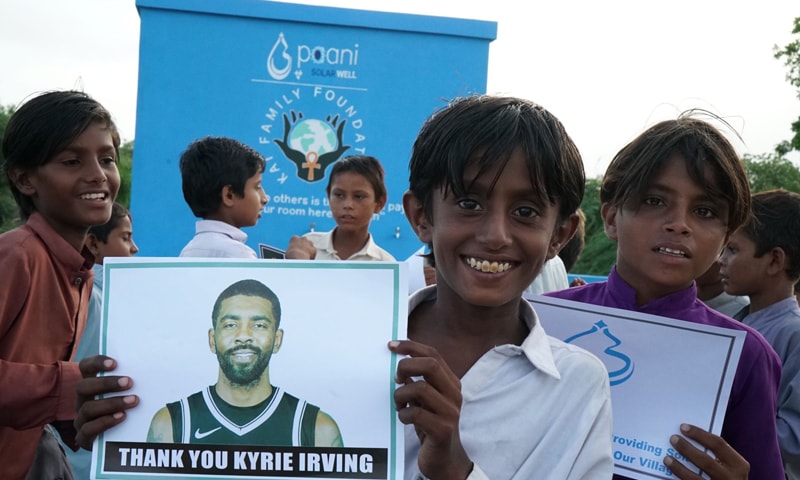 A villagers hold NBA star Kyrie Irving's photograph, that says 'Thank you Kyrie Irving'. — Photo courtesy  Paani Twitter