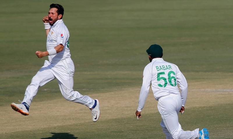 Pakistan's spinner Yasir Shah jumps to celebrate after taking the wicket of South Africa's Quinton de Kock during the fourth day of the first cricket test match between Pakistan and South Africa at the National Stadium on Jan 29. — AP