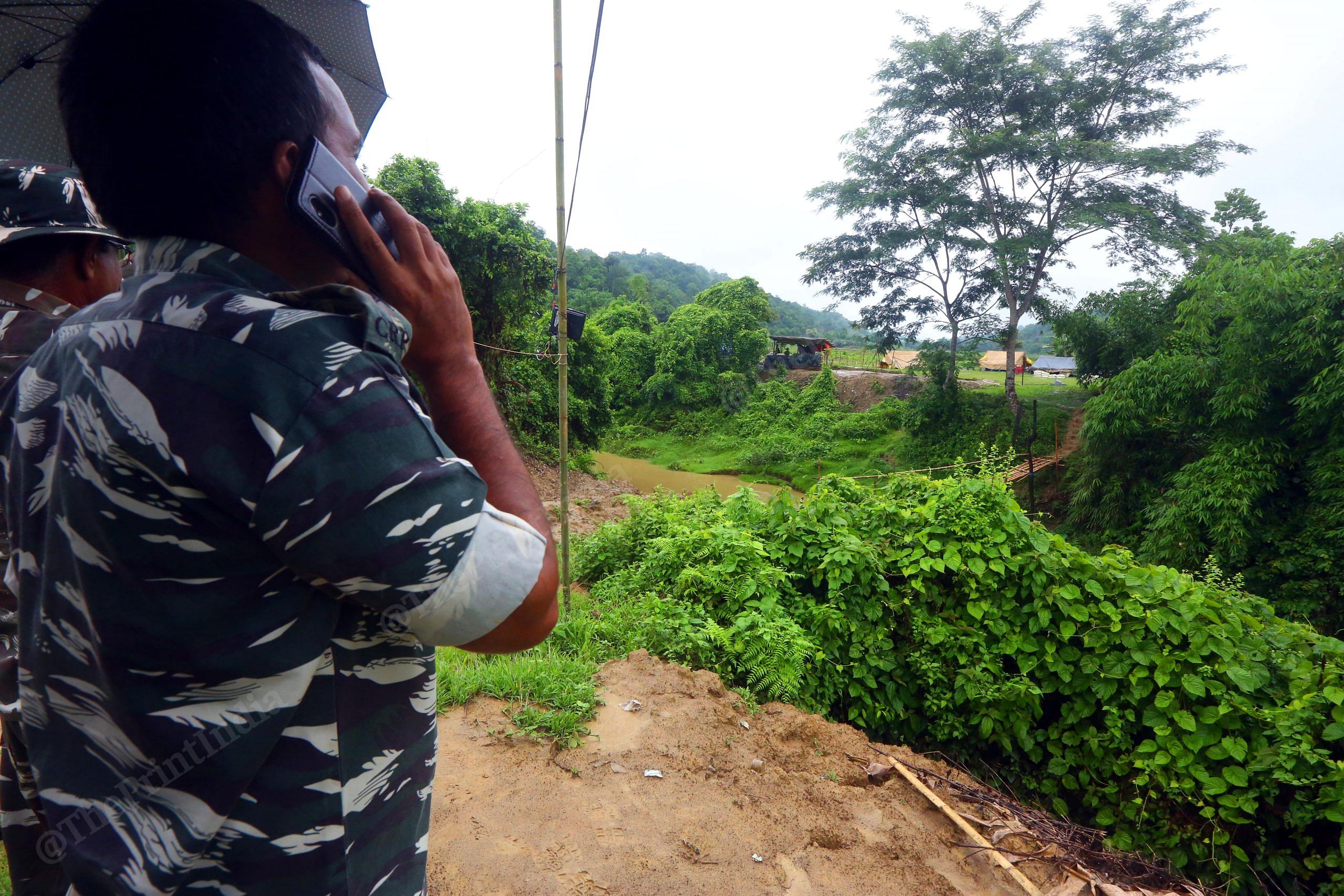 CRPF jawan communicating Mizoram police via Cell Phone at Kulichera post | Photo: Praveen Jain | ThePrint