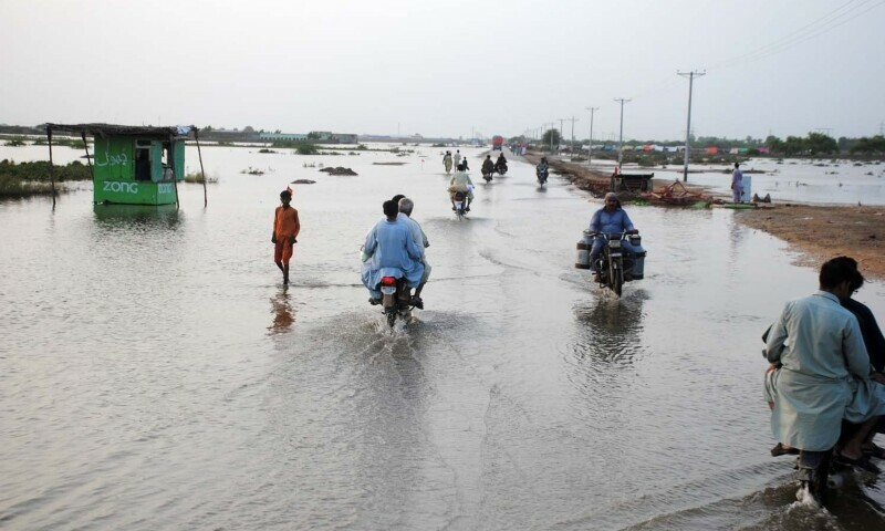 A view of a flooded road in Hyderabad division on Saturday. — Umair Ali