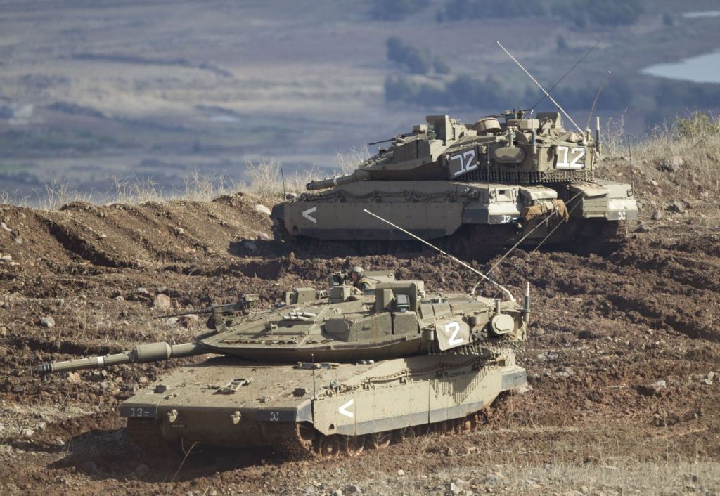 n+Israeli+tank+in+a+firing+position+in+the+Israeli-controlled+Golan+Heights+overlooking+the+Syrian+village+of+Bariqa%252C+Monday%252C+Nov.+12%252C+2012.+The+Israeli+military+says+Syrian+mobile+artillery+was+hit+after+respondin.jpg
