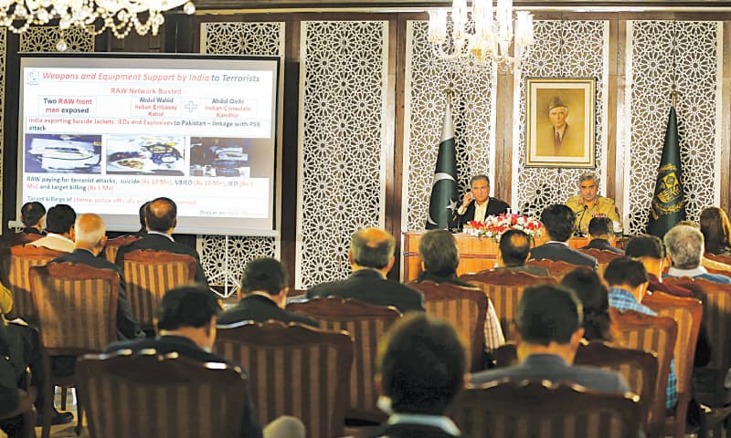 MILITARY spokesman Maj Gen Babar Iftikhar and Foreign Minister Shah Mehmood Qureshi addressing a press conference on Saturday.—AP