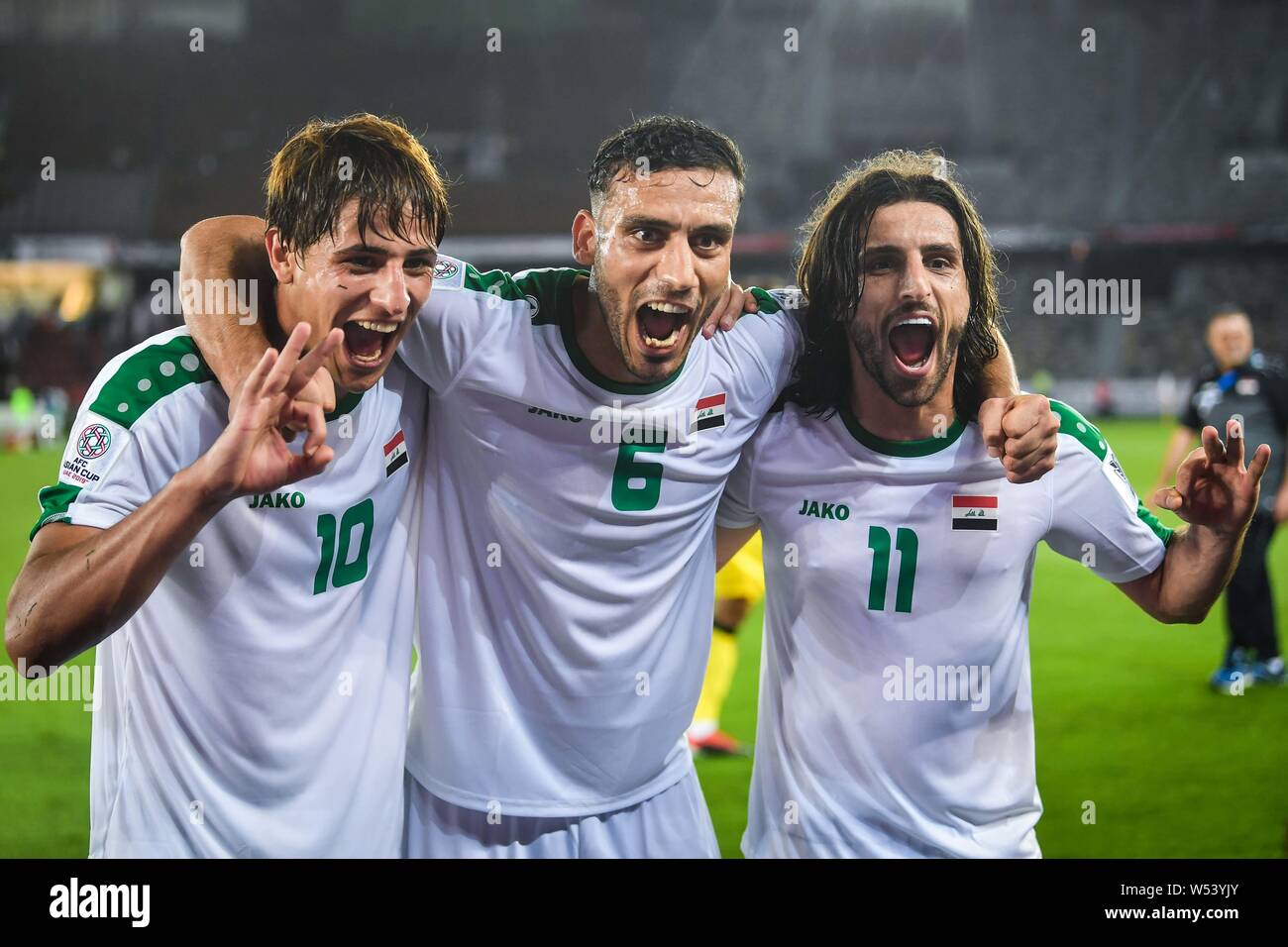 players-of-iraq-national-football-team-celebrate-after-defeating-vietnam-national-football-team-in-the-afc-asian-cup-group-d-match-in-abu-dhabi-unite-W53YJY.jpg