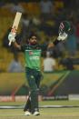 Babar Azam celebrates his century during the final one-day international in Lahore (AFP/Arif ALI)