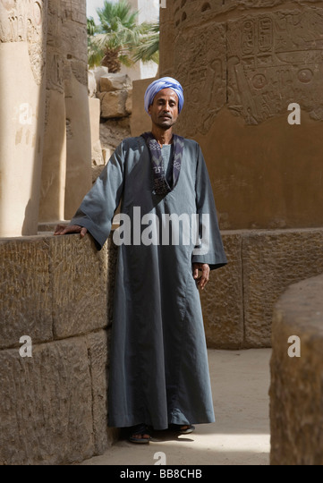 nubian-man-wearing-traditional-clothing-standing-between-columns-karnak-bb8chb.jpg