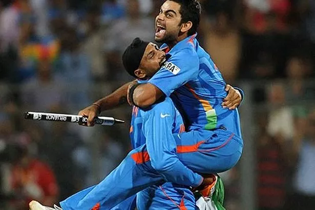india-cricketers-harbhajan-singh-and-virat-kohli-celebrate-their-victory-pic-getty-254167309.jpg