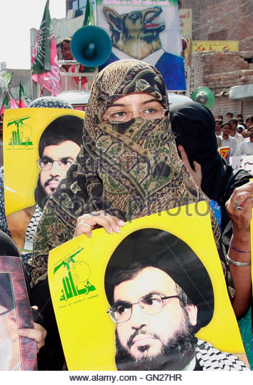 pakistani-shiite-muslims-hold-posters-of-hezbollah-leader-hassan-nasrallah-gn27hr.jpg