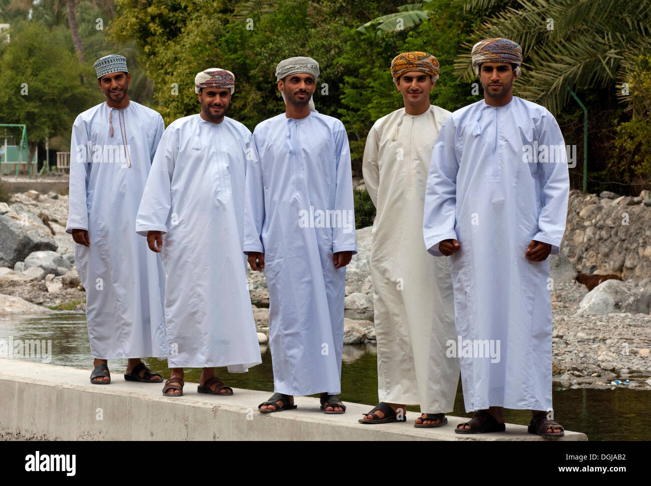 five-young-omani-men-wearings-traditional-dishdasha-festive-clothes-DGJAB2.jpg
