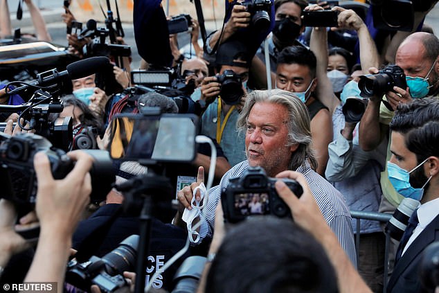 Bannon is surrounded by journalists as he leaves court in Manhattan last month