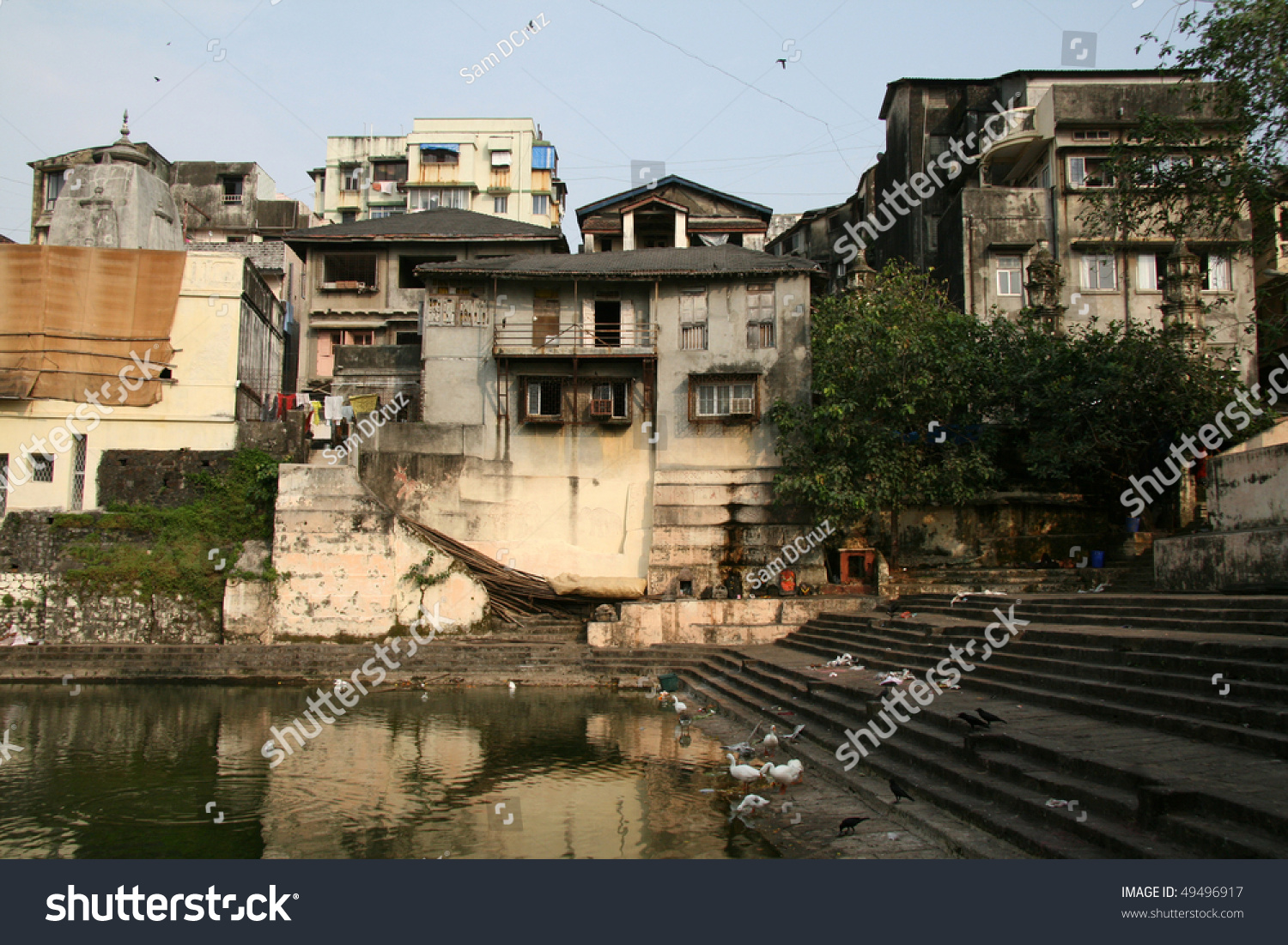 stock-photo-banaganga-tank-in-the-slums-of-the-city-mumbai-india-49496917.jpg