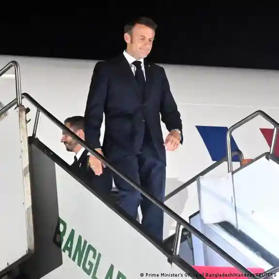 Emmanuel Macron gets off the plane in Bangladesh