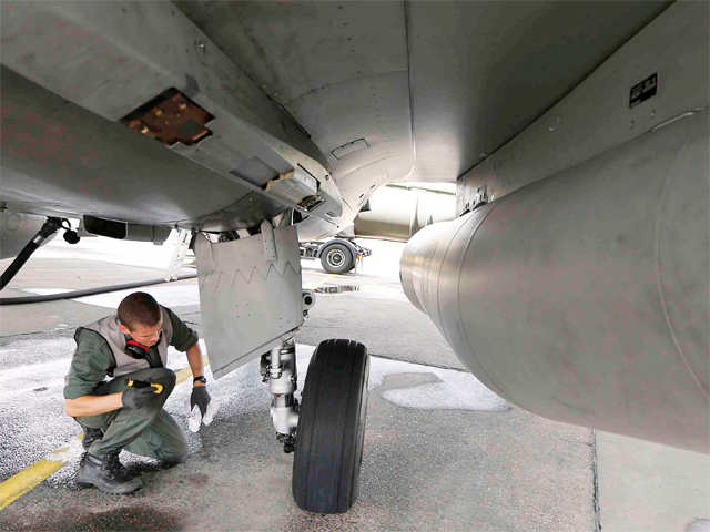 french-soldier-works-on-a-rafale-jet-fighter.jpg