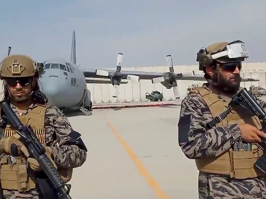 Members of Badri 313 military unit stand guard at Kabul's airport