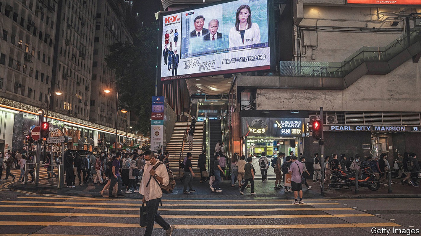 A public news broadcast of Chinese President Xi Jinping and US President Joe Biden's meeting on the sidelines of a Group of 20 summit in Bali, on a screen in Hong Kong, China, on Monday, Nov. 14, 2022. Biden and Xi shook hands at a hotel in Bali, Indonesia, on Monday before their first in-person meeting since Biden took office, one of the most closely watched encounters of his presidency. Photographer: Lam Yik/Bloomberg via Getty Images