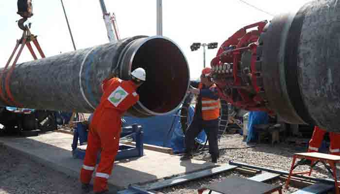 Workers are seen at the construction site of the Nord Stream 2 gas pipeline, near the town of Kingisepp, Leningrad region, Russia, June 5, 2019.File photo