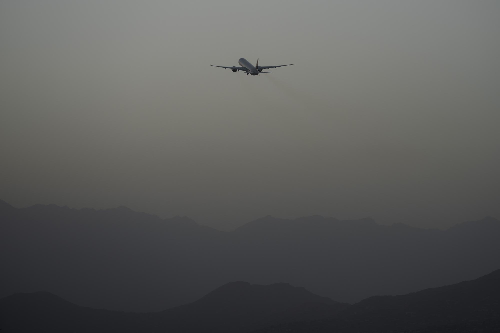 FILE - A Qatar Airways aircraft takes off with foreigners from the airport in Kabul, Afghanistan, Thursday, Sept. 9, 2021, as some 200 foreigners, including Americans, flew out of the country, the first such large-scale departure since U.S and foreign forces concluded their frantic withdrawal at the end of the previous month. (AP Photo/Bernat Armangue, File)