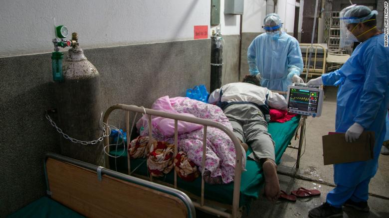 Nepali doctors treat a Covid-19 patient on the corridor of the emergency ward of a hospital in Kathmandu, Nepal on May 5.