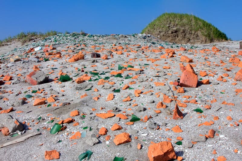 beach-shards-glass-brick-sandy-littered-52976721.jpg
