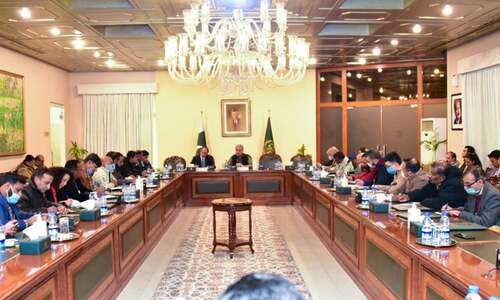 Foreign Minister Shah Mahmood Qureshi interacts with media persons in Islamabad on Friday. — Photo by Naveed Siddiqui