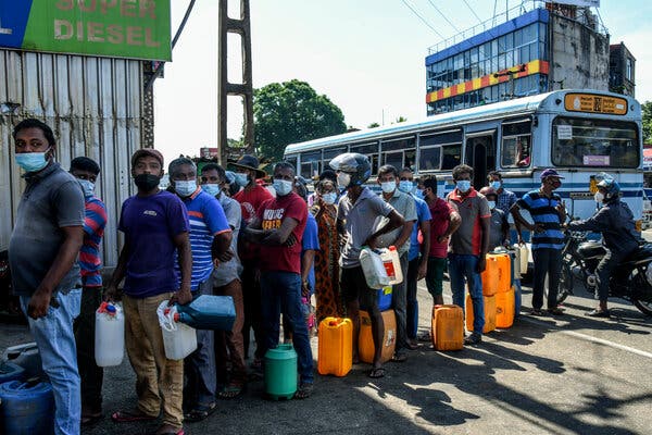 Lining up to buy diesel fuel  in  Colombo this month. Two men died earlier this week in Sri Lanka while waiting in similarly long lines on scorching hot days.