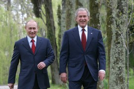 US President George W Bush and Russian President Vladimir Putin walk together at Putin's Black Sea summer retreat, Bocharov Ruchey in Sochi on April 6, 2008 [File: Ria Novosti via Reuters/Vladimir Rodionov]