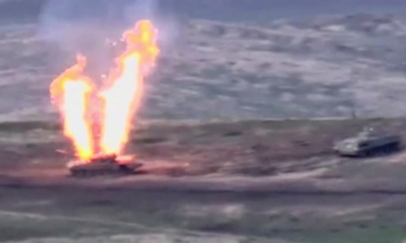 A still image from a video released by the Armenian Defence Ministry shows what is said to be Azerbaijani armoured vehicles, one of which is destroyed by Armenian armed forces in the breakaway region of Nagorno-Karabakh, in this still image from footage released on September 27, 2020. — Reuters