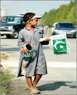 islamabad-young-pakistan-youth-on-road-flags-independence-day.jpg
