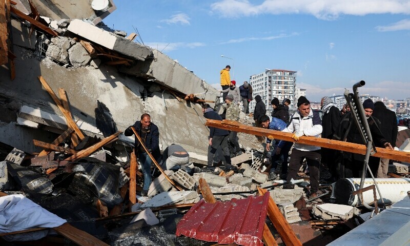 People look amid rubble as the search for survivors continues following an earthquake in Hatay, Turkiye, February 7, 2023. — Reuters